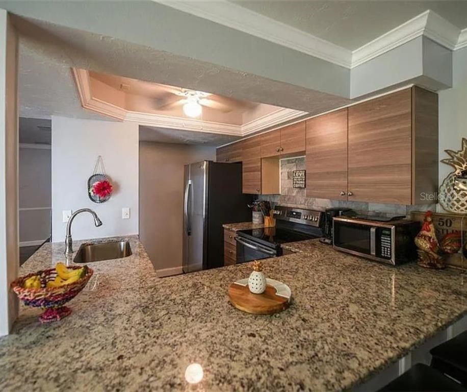 1112 Longfellow Road Sarasota, FL 34243 - Photo 18 of 48 a bedroom with furniture and a wooden floor