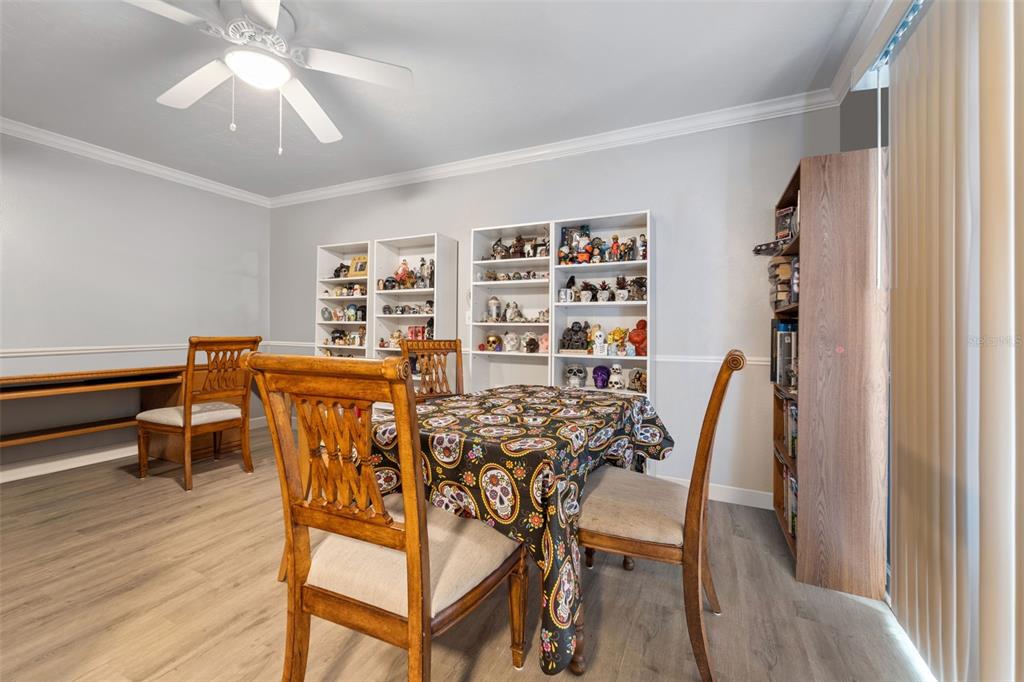 1112 Longfellow Road Sarasota, FL 34243 - Photo 20 of 48 a view of a dining room with furniture and wooden floor