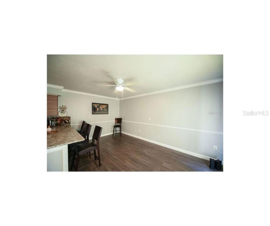 1112 Longfellow Road Sarasota, FL 34243 - Photo 23 of 48 a living room with furniture and a table