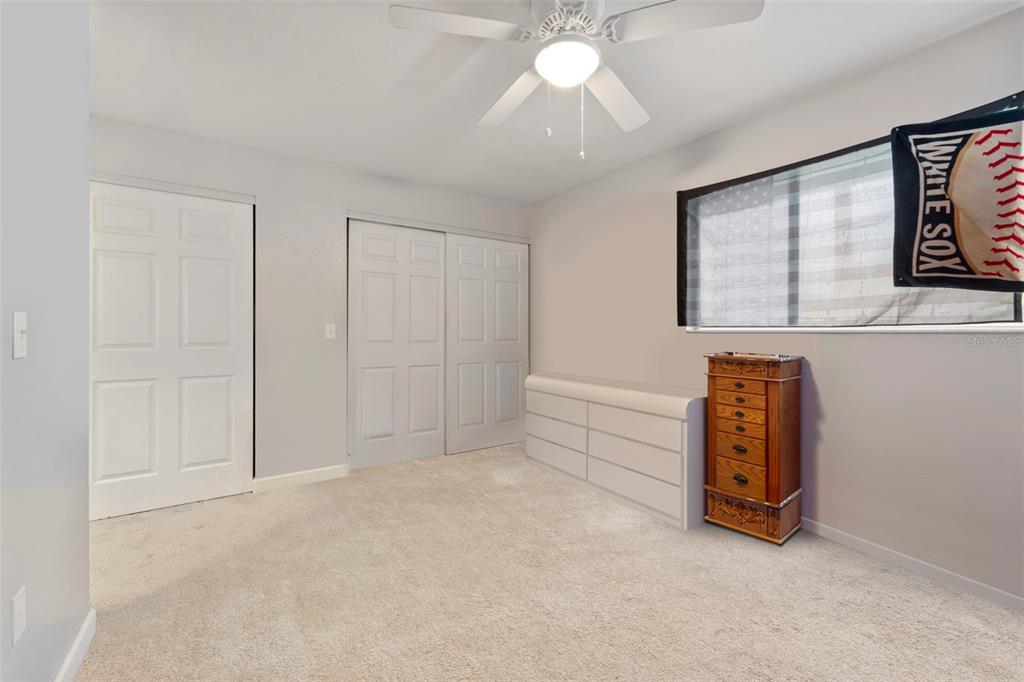 1112 Longfellow Road Sarasota, FL 34243 - Photo 30 of 48 an empty room with windows and fan