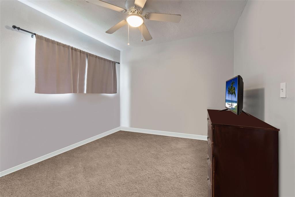 1112 Longfellow Road Sarasota, FL 34243 - Photo 31 of 48 an empty room with a ceiling fan and a window