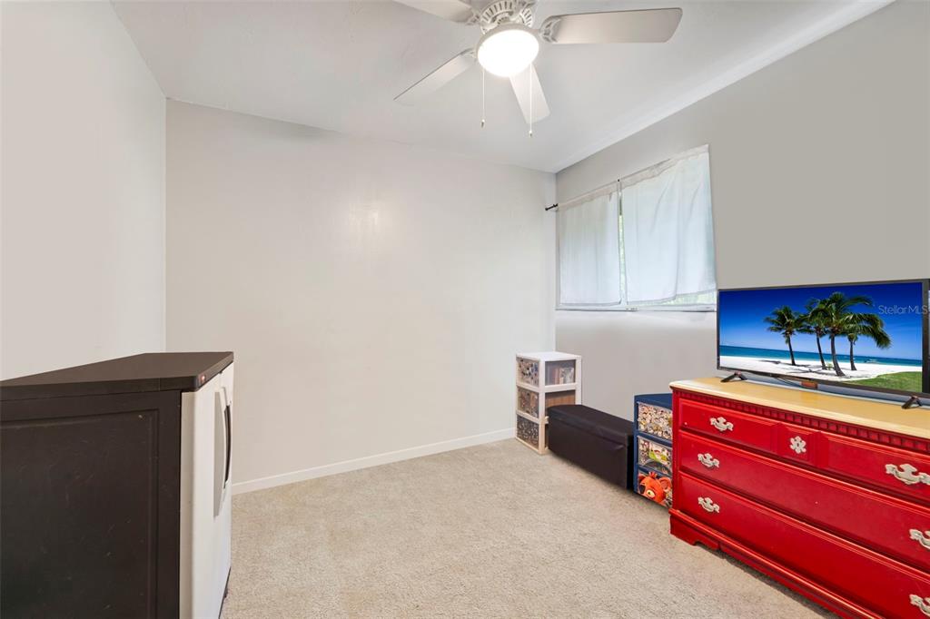1112 Longfellow Road Sarasota, FL 34243 - Photo 35 of 48 a living room with furniture and a chandelier