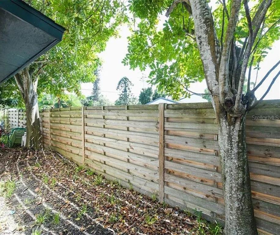 1112 Longfellow Road Sarasota, FL 34243 - Photo 48 of 48 a view of a wooden fence and trees