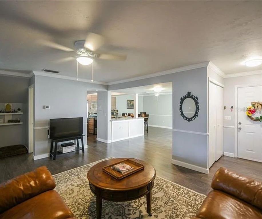 1112 Longfellow Road Sarasota, FL 34243 - Photo 6 of 48 a living room with furniture and a table