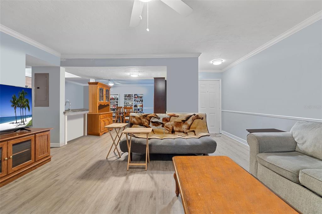 1112 Longfellow Road Sarasota, FL 34243 - Photo 8 of 48 a living room with furniture and a wooden floor