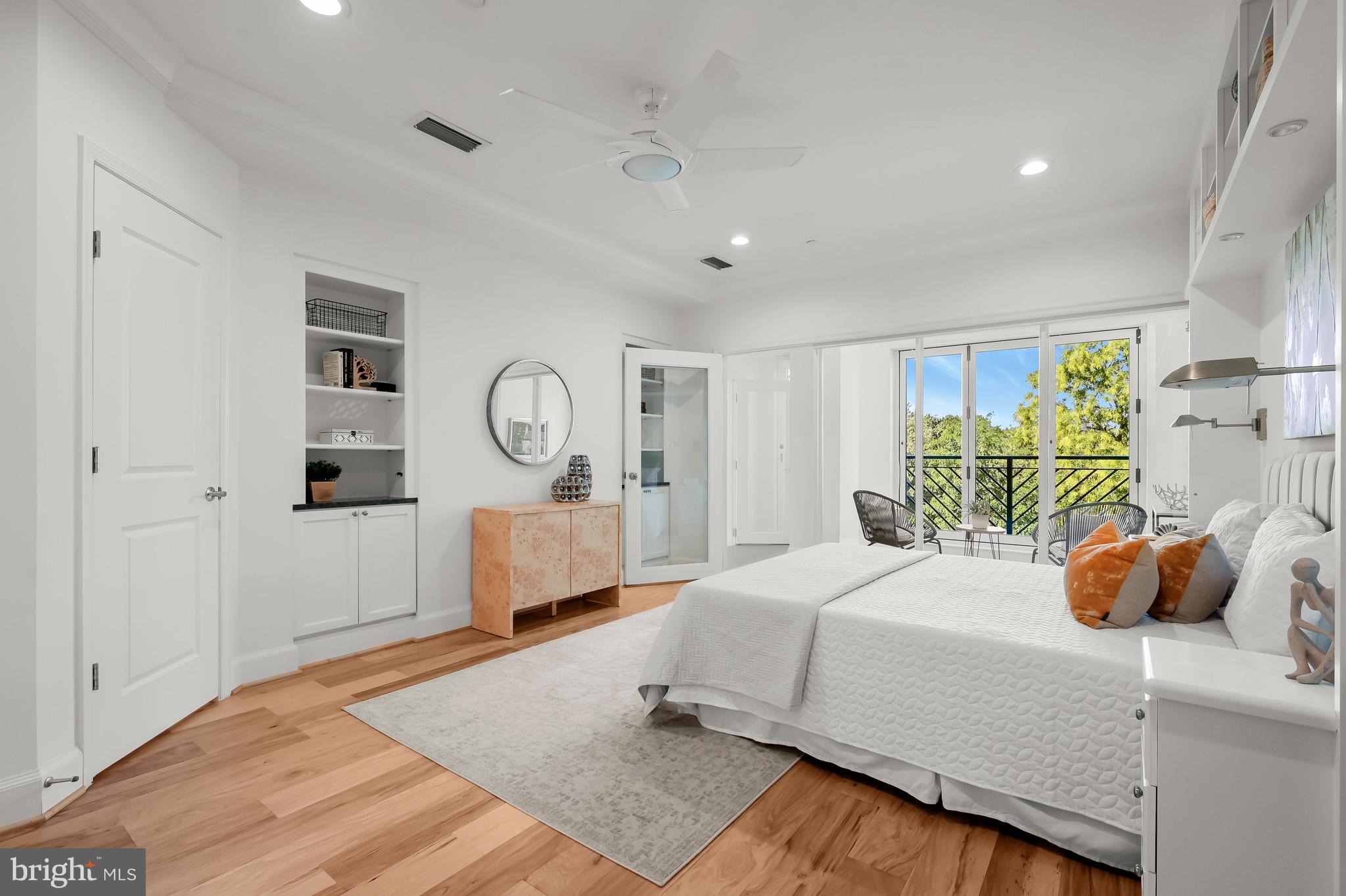 1414 22nd Street Northwest, Unit 41 Washington, DC 20037 - Photo 17 of 36 a bedroom with a bed a window and dresser