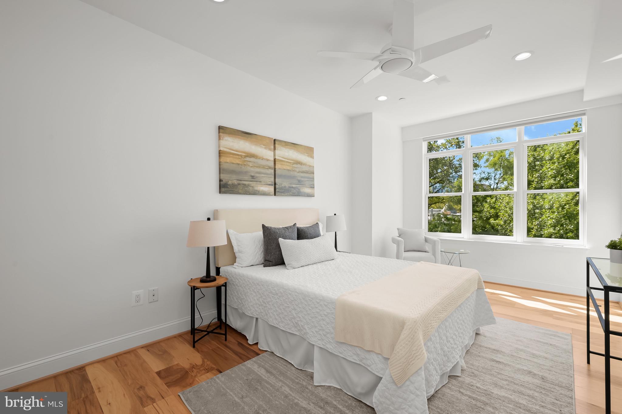 1414 22nd Street Northwest, Unit 41 Washington, DC 20037 - Photo 22 of 36 a bedroom with a bed and a large window