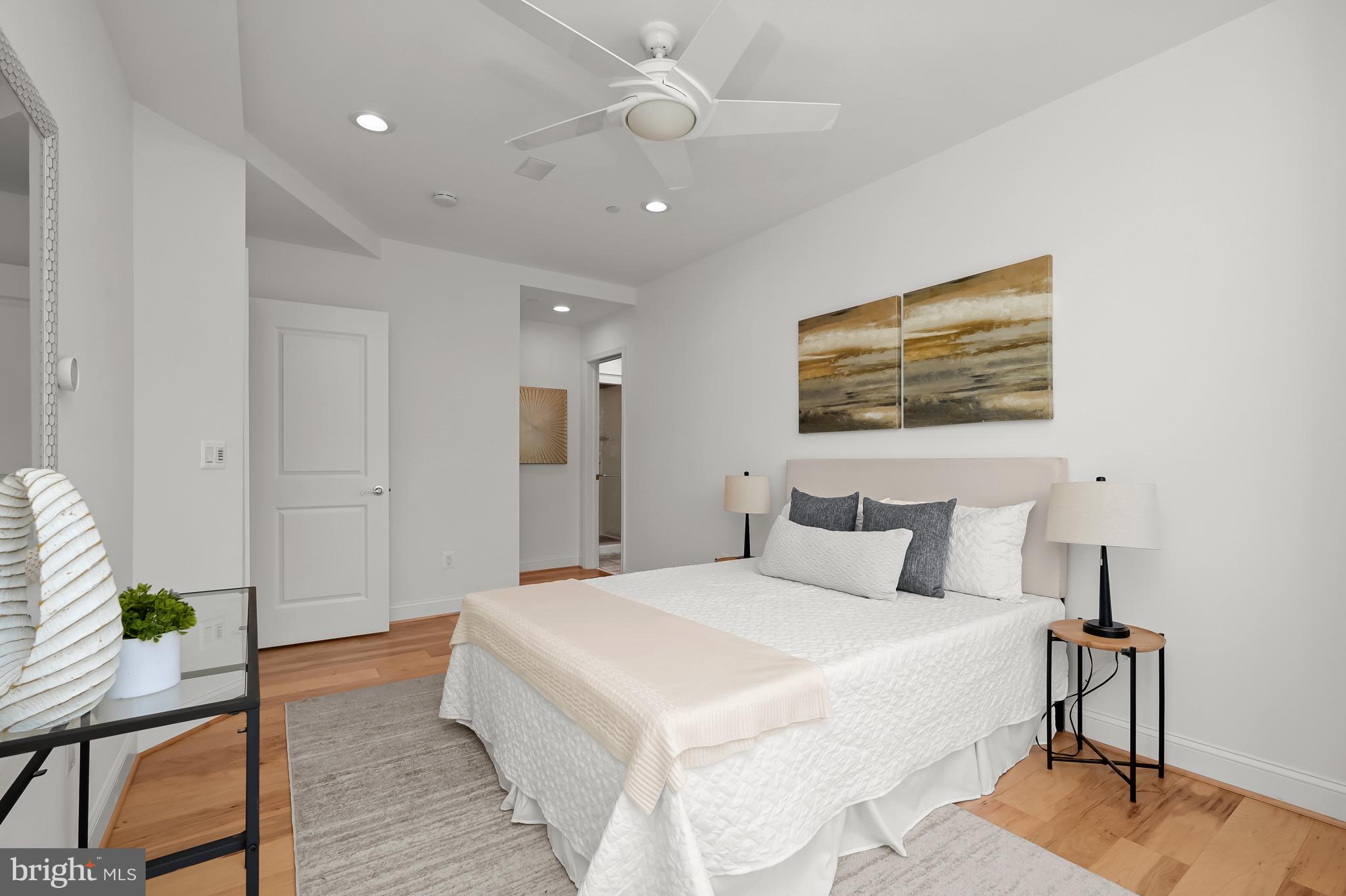 1414 22nd Street Northwest, Unit 41 Washington, DC 20037 - Photo 23 of 36 a spacious bedroom with a bed and a table