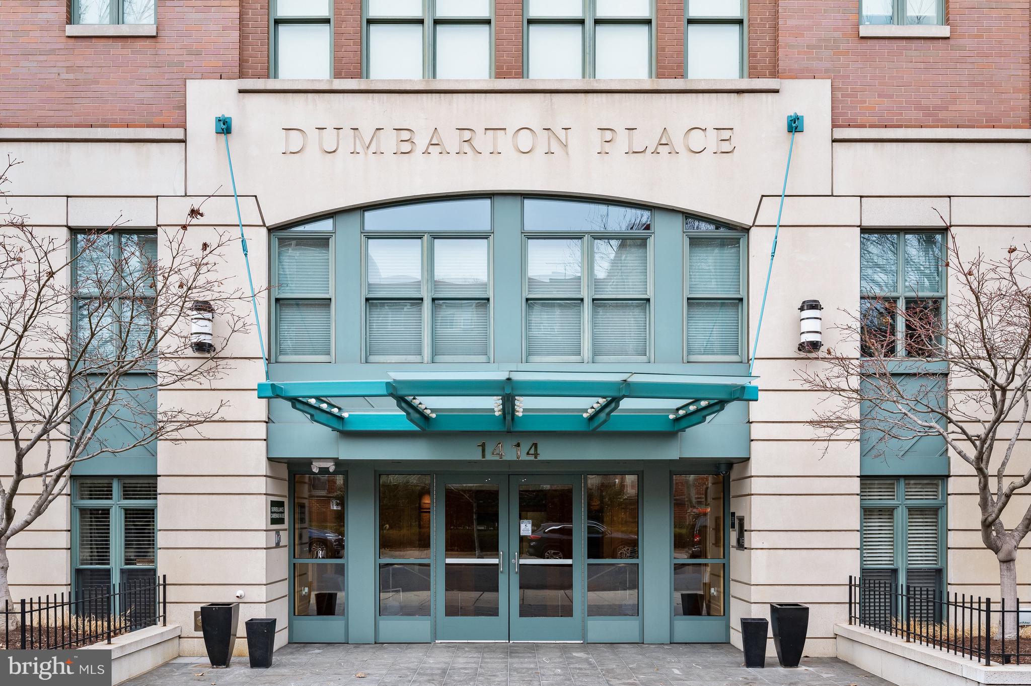 1414 22nd Street Northwest, Unit 41 Washington, DC 20037 - Photo 3 of 36 a front view of a building with a garden