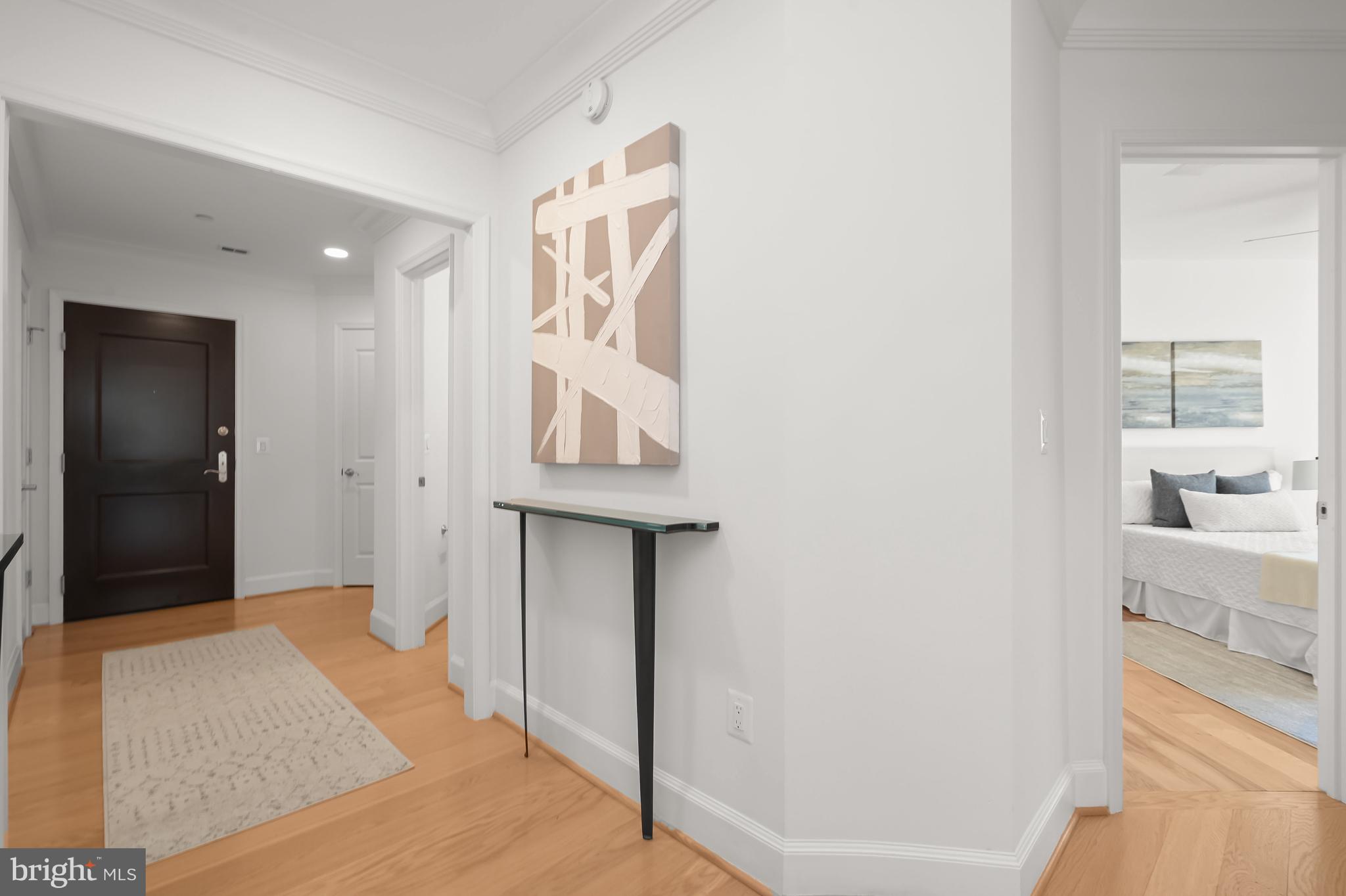 1414 22nd Street Northwest, Unit 41 Washington, DC 20037 - Photo 4 of 36 a bedroom with a bed and a view of bathroom