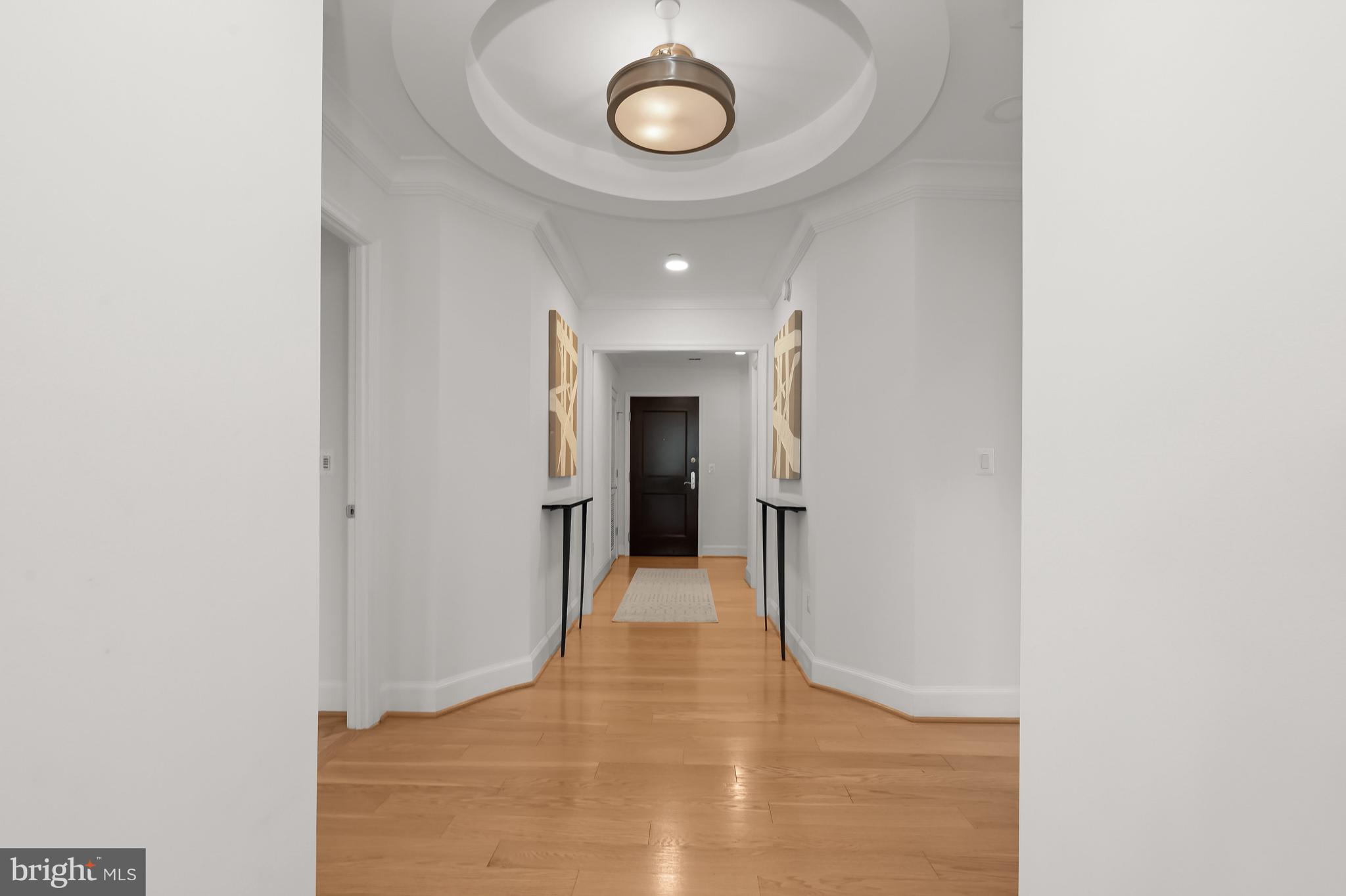 1414 22nd Street Northwest, Unit 41 Washington, DC 20037 - Photo 6 of 36 a view of a hallway with wooden floor