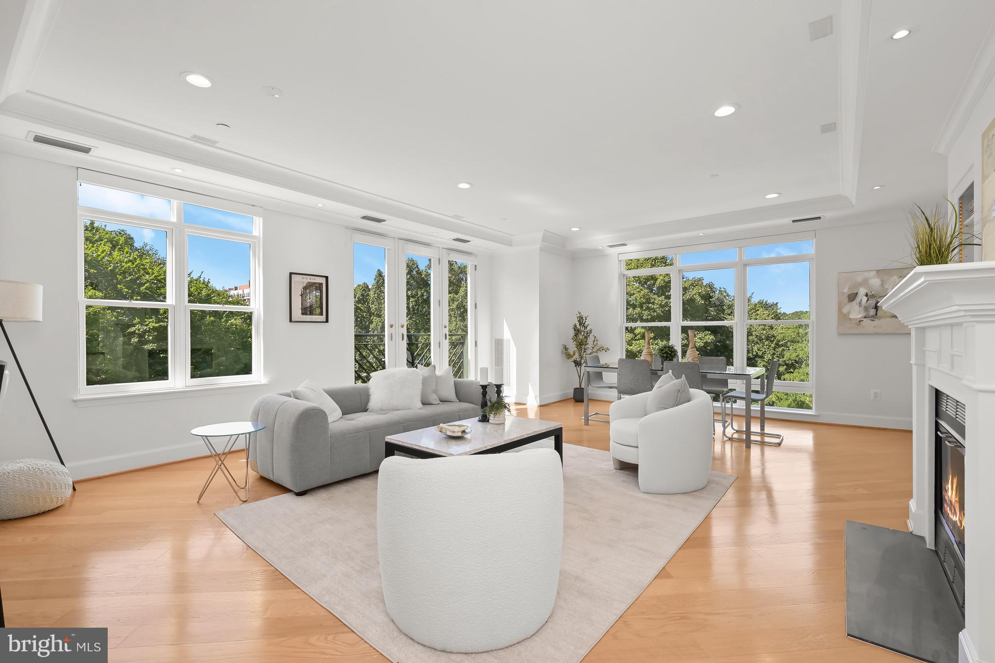 1414 22nd Street Northwest, Unit 41 Washington, DC 20037 - Photo 8 of 36 a living room with fireplace furniture and a large window