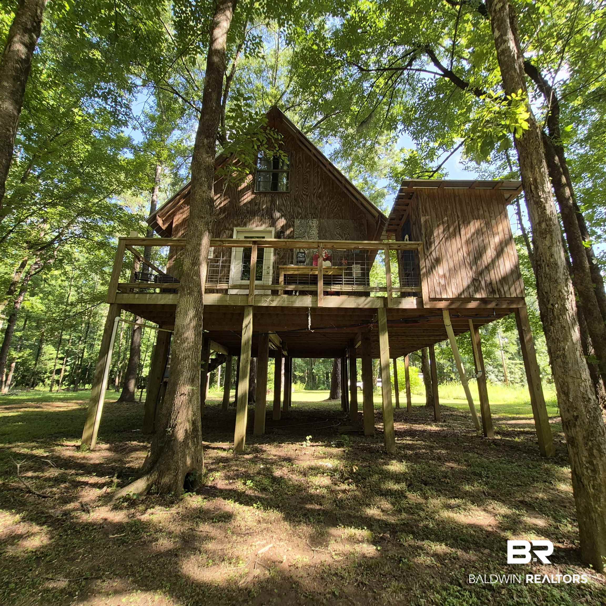 0 Eureka Landing Road Uriah, AL 36480 - Photo 26 of 27 Elevated timber-frame structure with a pitched roof and a spacious wooden deck