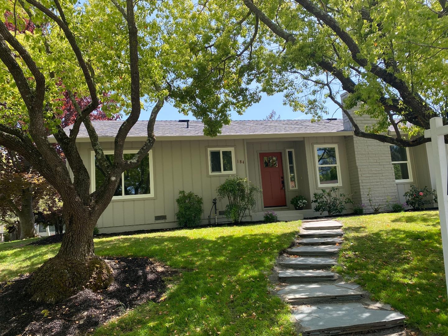 a front view of a house with a yard