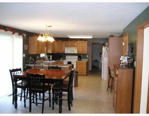 925 Logan Road Tarentum, PA 15084 - Photo 6 of 18 Kitchen. SUNNY BREAKFAST AREA OR WORK AREA OFF KITCHEN LOOKING OUT REAR YARD FROM SLIDING GLASS DOORS.