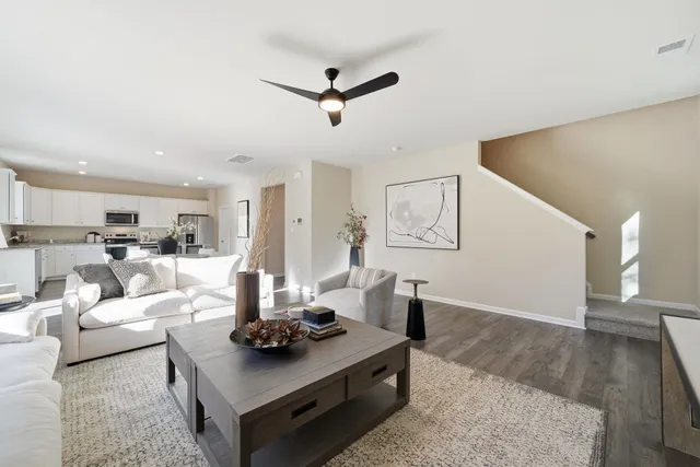 a view of a dining room with furniture and wooden floor