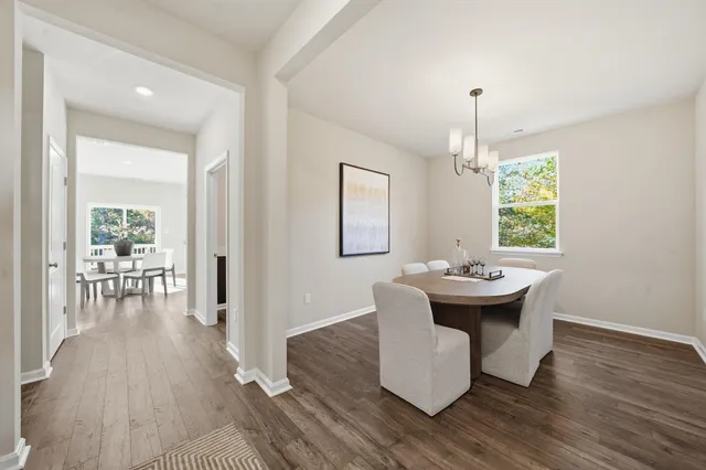 a bedroom with a bed a couch and dresser