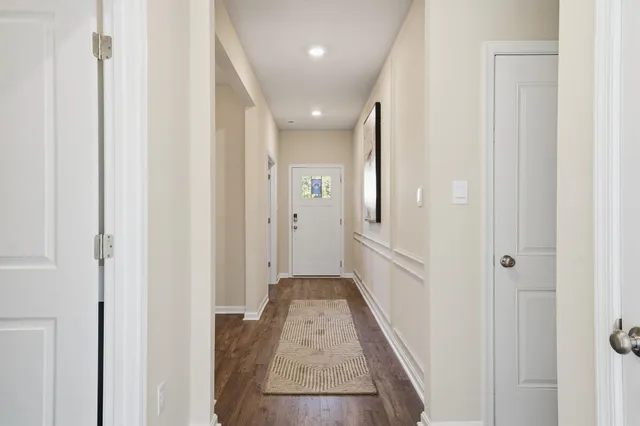 a dining room with furniture and wooden floor
