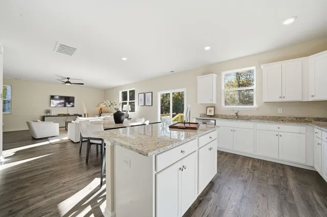 a living room with furniture and windows