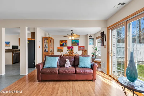a living room with furniture and a large window