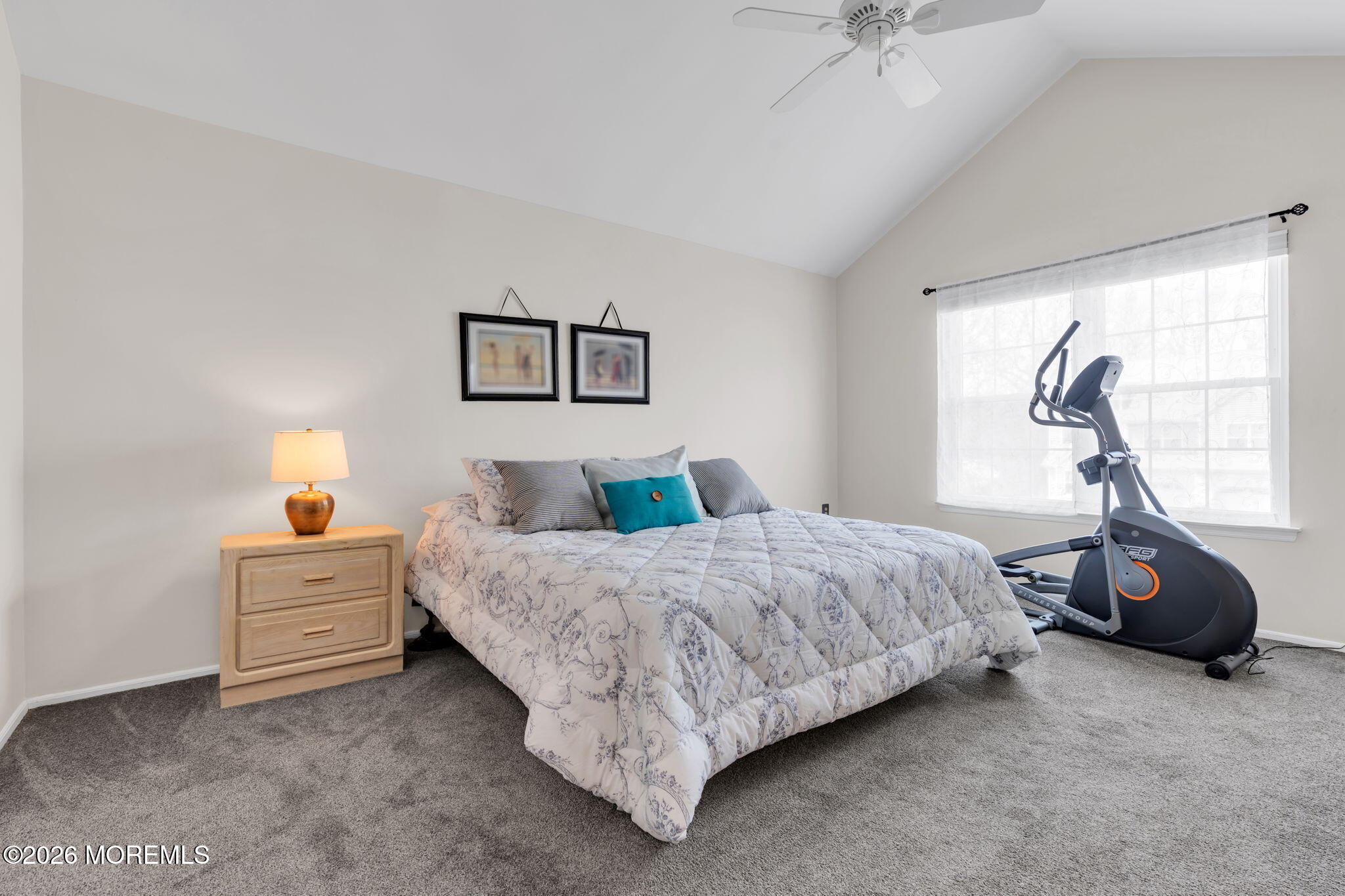 228 Moses Milch Drive Howell, NJ 07731 - Photo 18 of 26 a bedroom with a bed and a chandelier