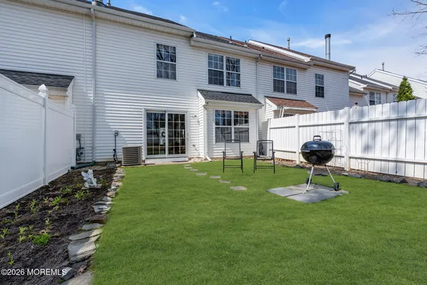 a front view of a house with a yard and porch