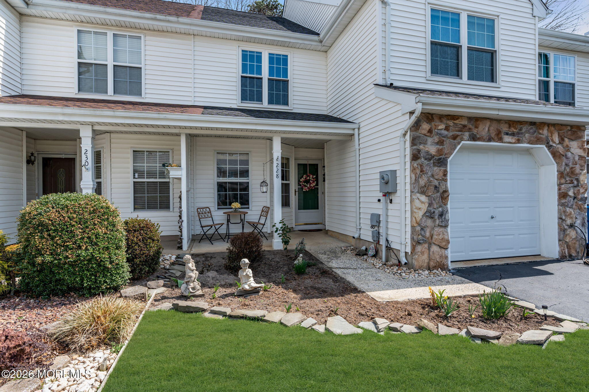 228 Moses Milch Drive Howell, NJ 07731 - Photo 3 of 26 a front view of a house with garden