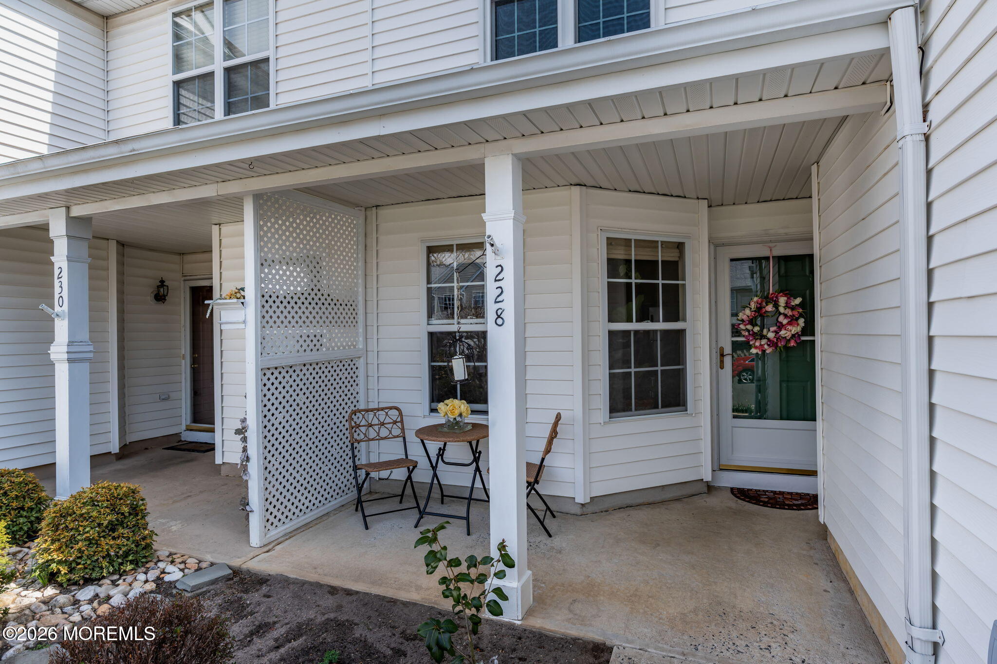 228 Moses Milch Drive Howell, NJ 07731 - Photo 4 of 26 a view of front door and chair and tables