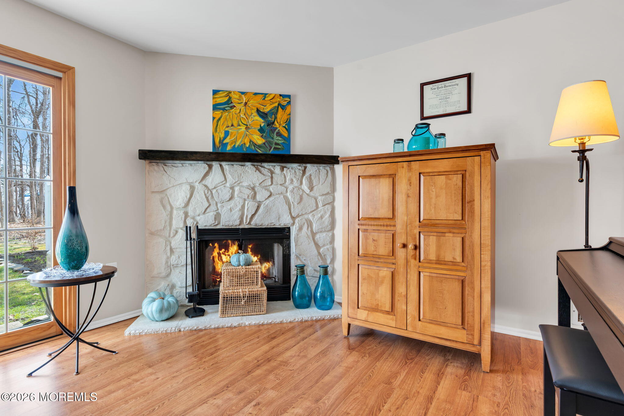 228 Moses Milch Drive Howell, NJ 07731 - Photo 7 of 26 a living room with furniture and a fireplace