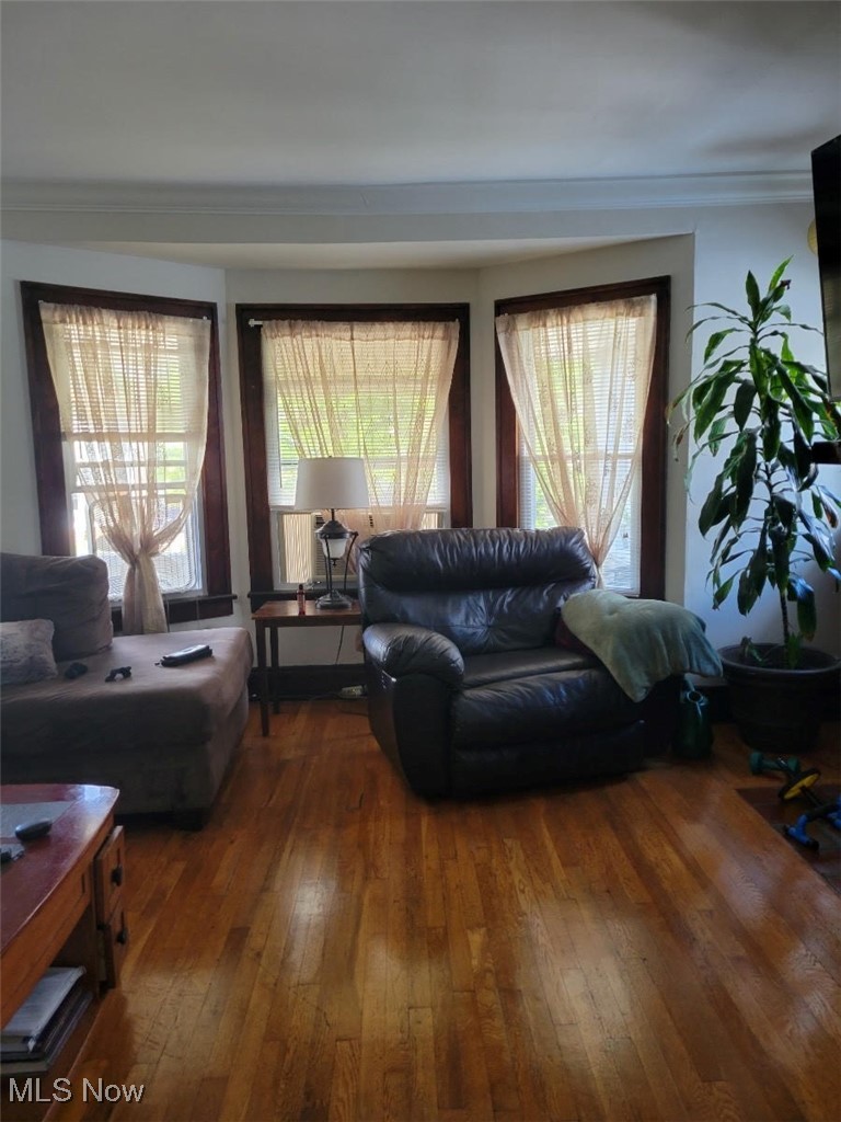 3276 Berea Road Cleveland, OH 44111 - Photo 8 of 10 Living room with wood-type flooring and ornamental molding