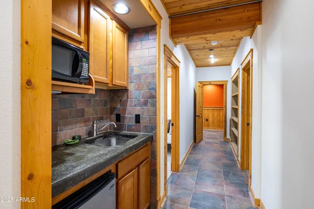 a view of balcony with wooden floor and outdoor seating