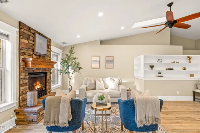 a living room with furniture and a fireplace