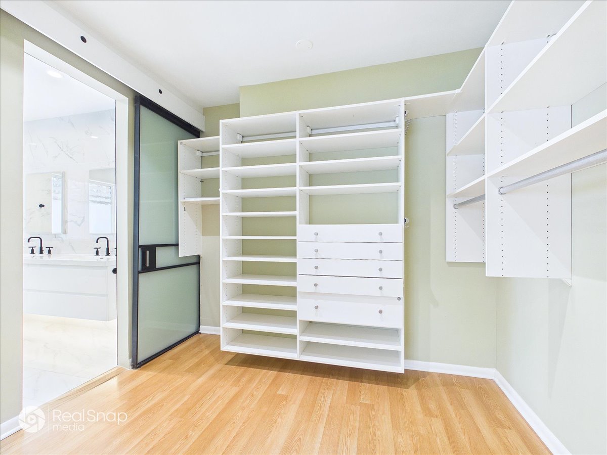 730 Sheridan Road Highland Park, IL 60035 - Photo 20 of 48 a view of walk in closet with empty racks