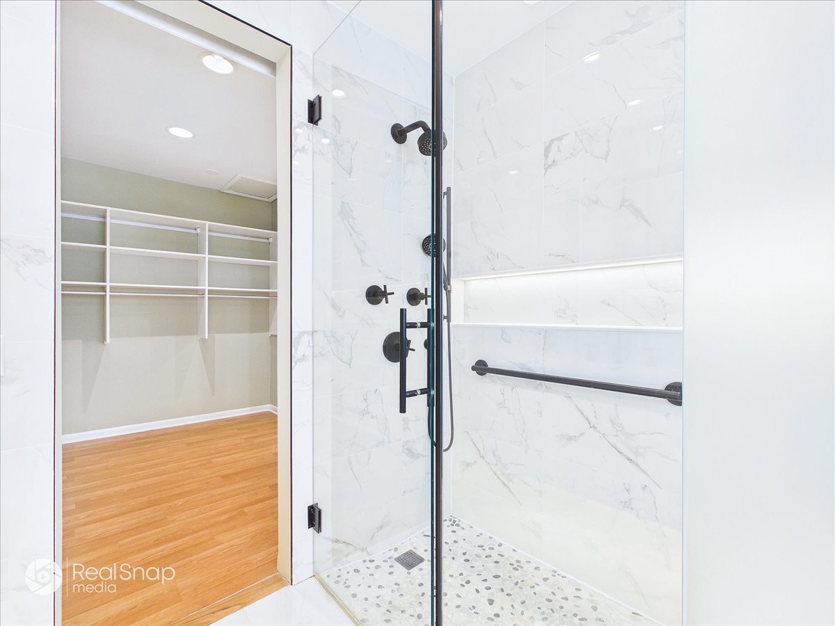 730 Sheridan Road Highland Park, IL 60035 - Photo 22 of 48 a bathroom with a glass shower door