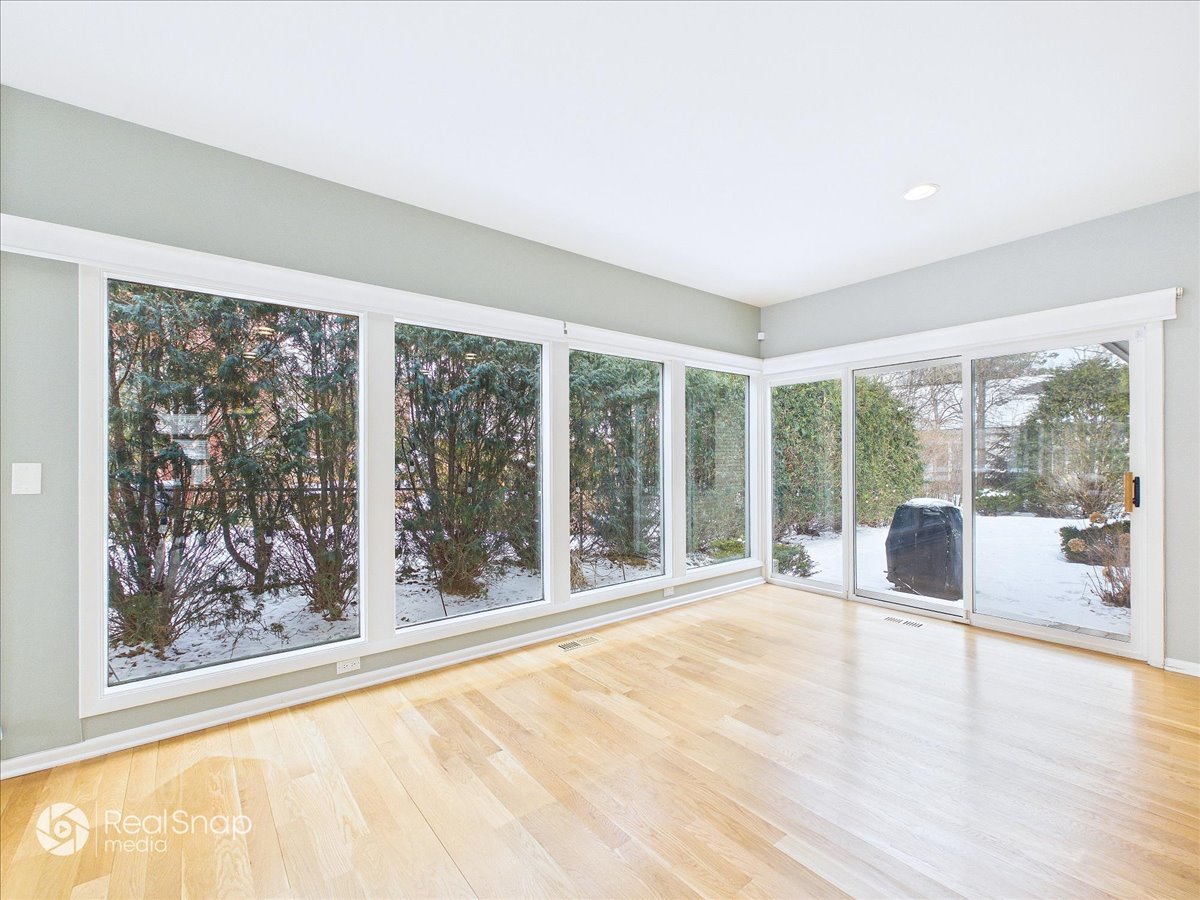730 Sheridan Road Highland Park, IL 60035 - Photo 8 of 48 a view of an empty room with wooden floor and a large window