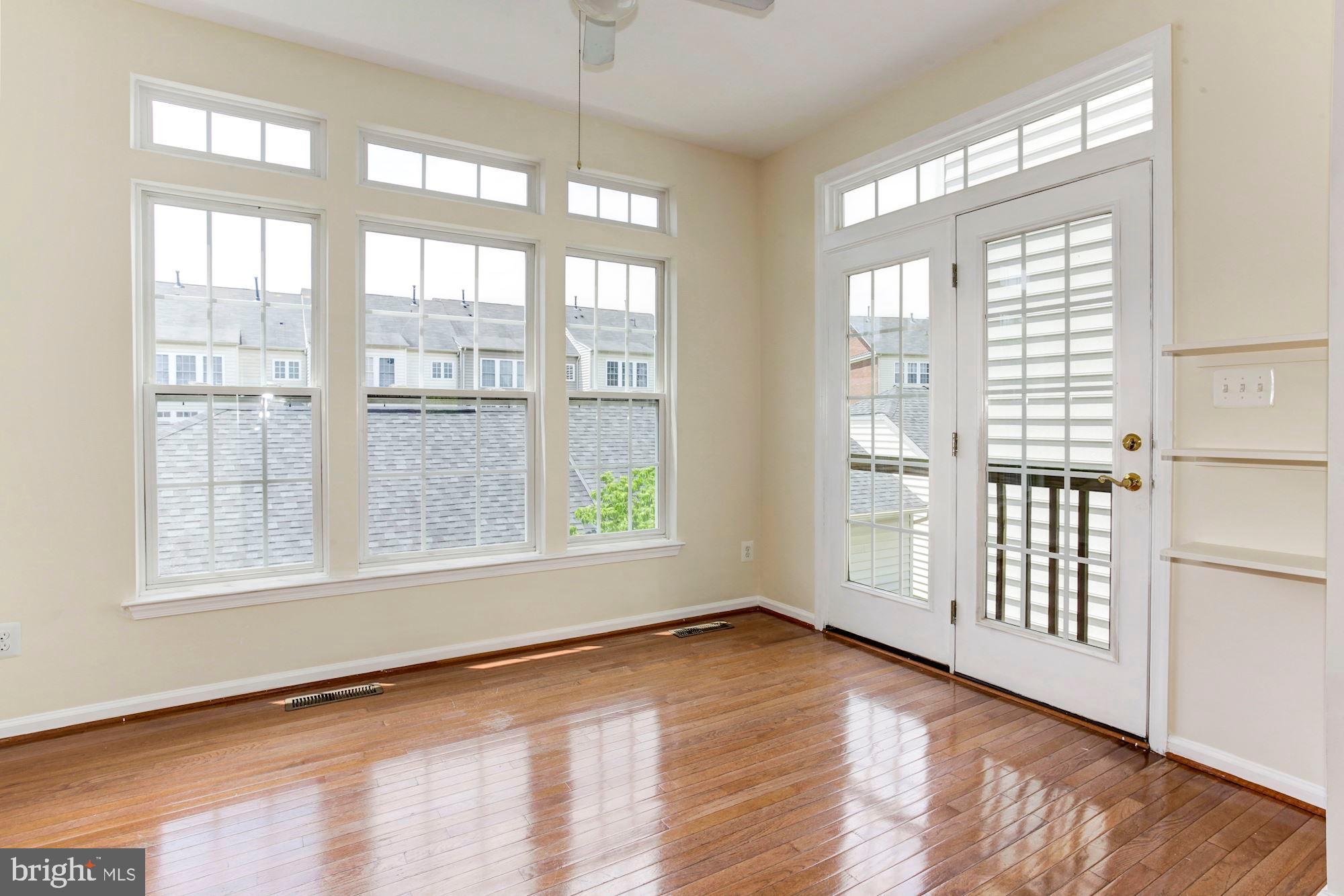 16618 Barge Circle Woodbridge, VA 22191 - Photo 39 of 65 Main Level sunroom with ceiling fan