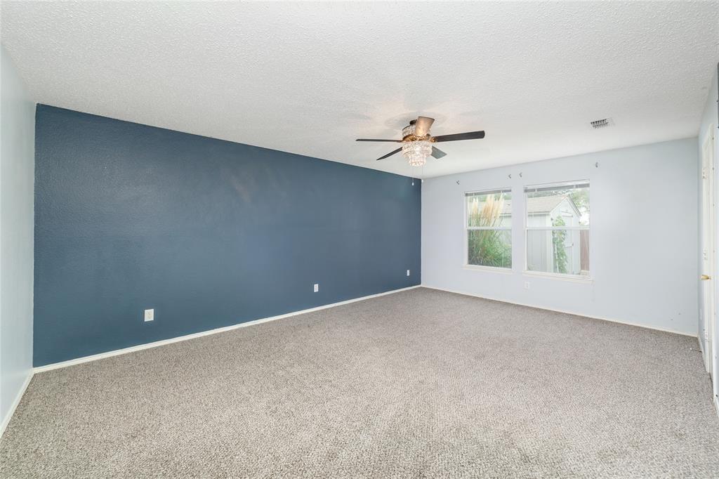 4408 Statesman Lane Fort Worth, TX 76244 - Photo 18 of 40 Carpeted empty room featuring ceiling fan and a textured ceiling