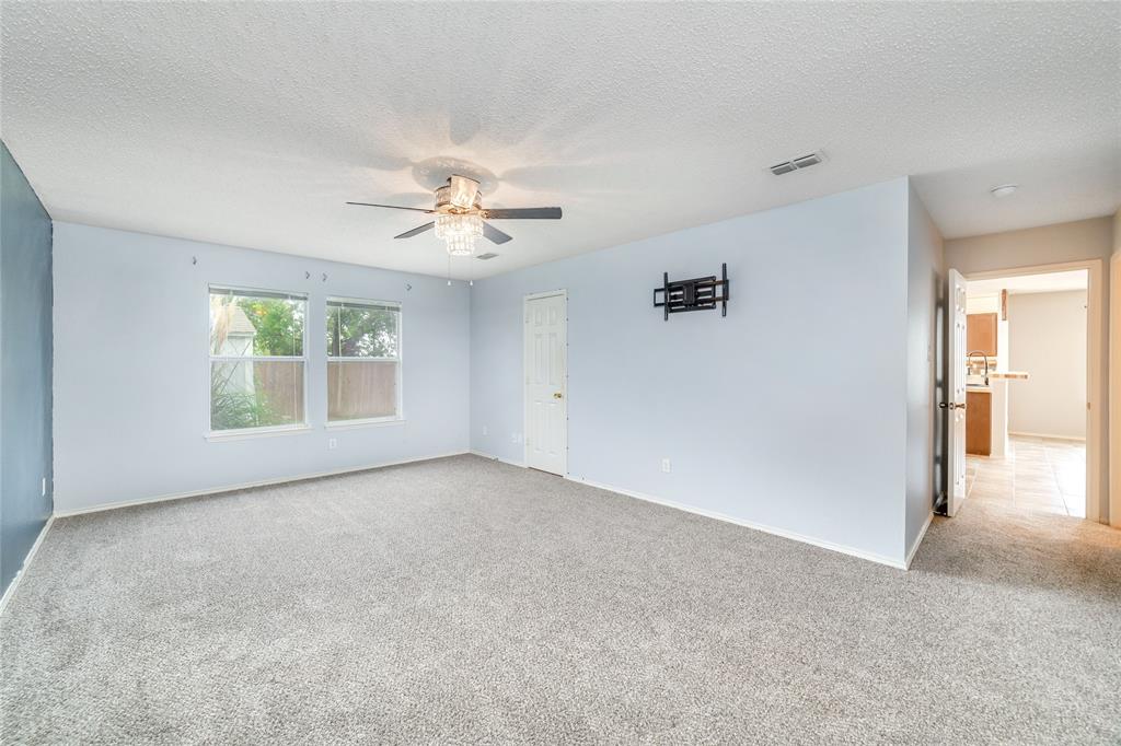 4408 Statesman Lane Fort Worth, TX 76244 - Photo 19 of 40 Carpeted empty room featuring ceiling fan and a textured ceiling