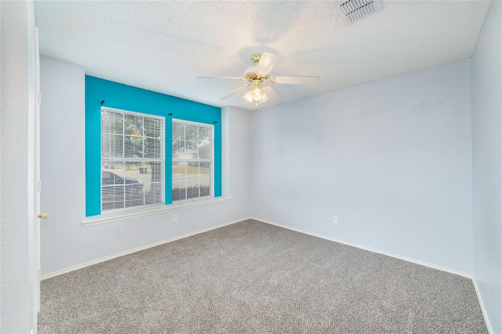 4408 Statesman Lane Fort Worth, TX 76244 - Photo 25 of 40 Carpeted spare room with ceiling fan and a textured ceiling