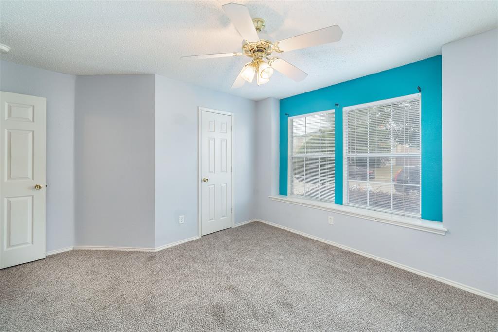 4408 Statesman Lane Fort Worth, TX 76244 - Photo 26 of 40 Empty room with carpet flooring, a textured ceiling, and ceiling fan