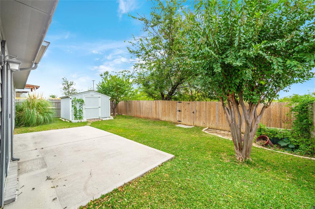 4408 Statesman Lane Fort Worth, TX 76244 - Photo 31 of 40 View of yard featuring a patio and a shed