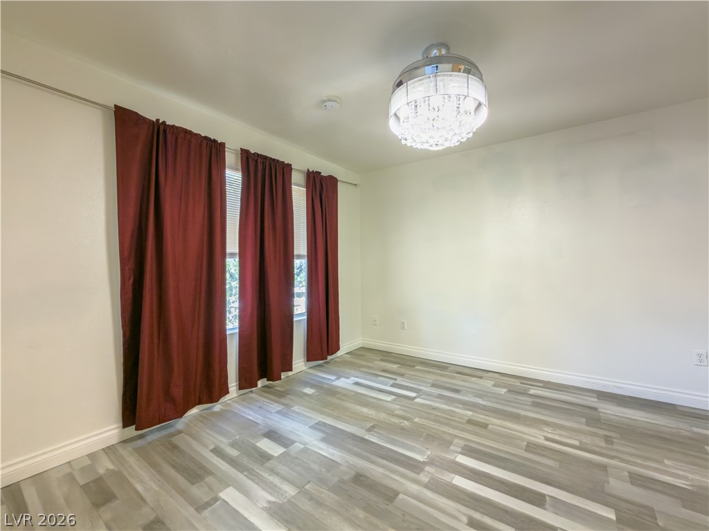 8070 West Russell Road, Unit 2063 Las Vegas, NV 89113 - Photo 8 of 9 Luminous room features broad windows with blinds and eye-catching overhead lighting.