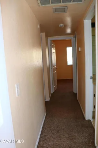 a view of hallway with stairs