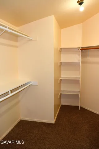 a view of an empty walk in closet