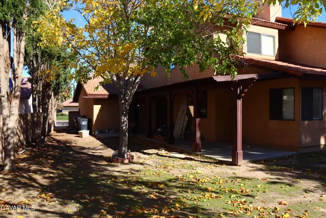 a tree in front of a house