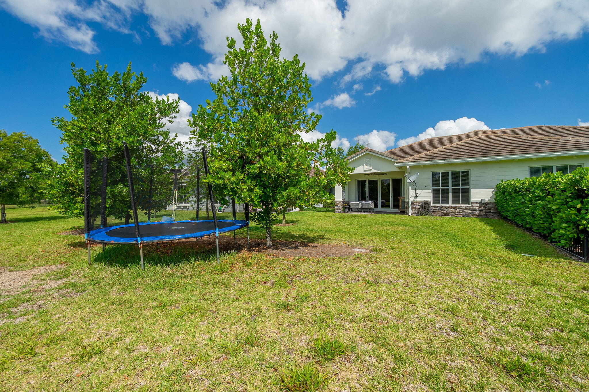 19546 Weathervane Way Loxahatchee, FL 33470 - Photo 36 of 63 a view of a house with a yard porch and sitting area