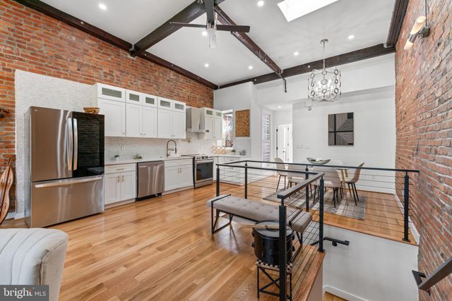 a view of balcony with furniture and wooden floor