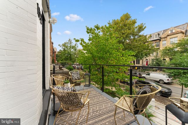 a workspace with furniture and window