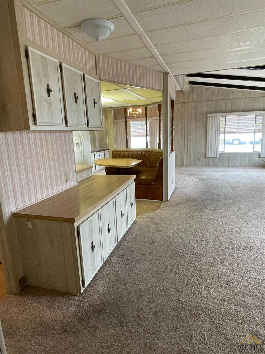 Undisclosed Address Bakersfield, CA 93308 - Photo 13 of 40 a large white kitchen with a large window