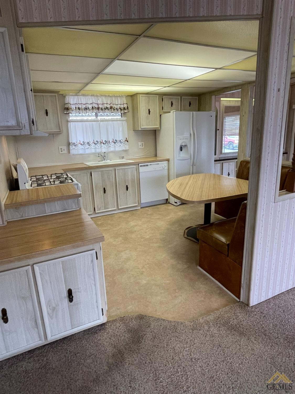 Undisclosed Address Bakersfield, CA 93308 - Photo 20 of 40 a kitchen with stainless steel appliances granite countertop a sink and cabinets